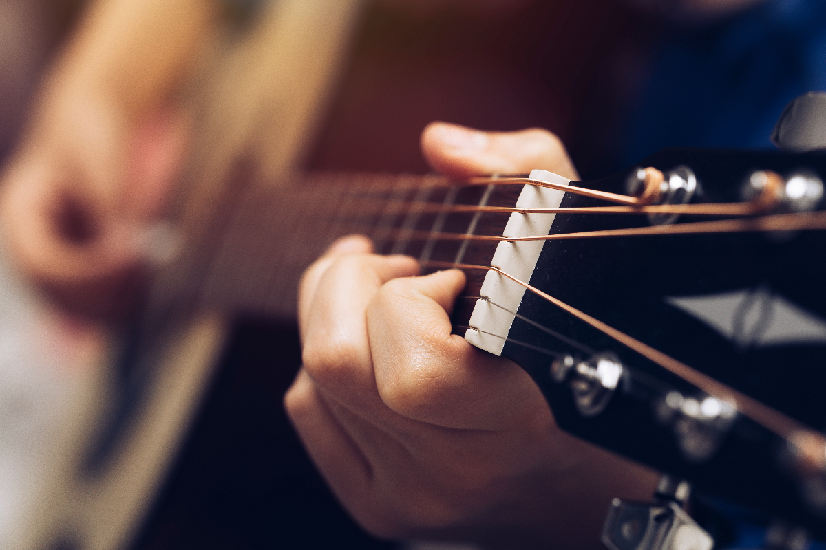 Close-up of a musician playing the guitar