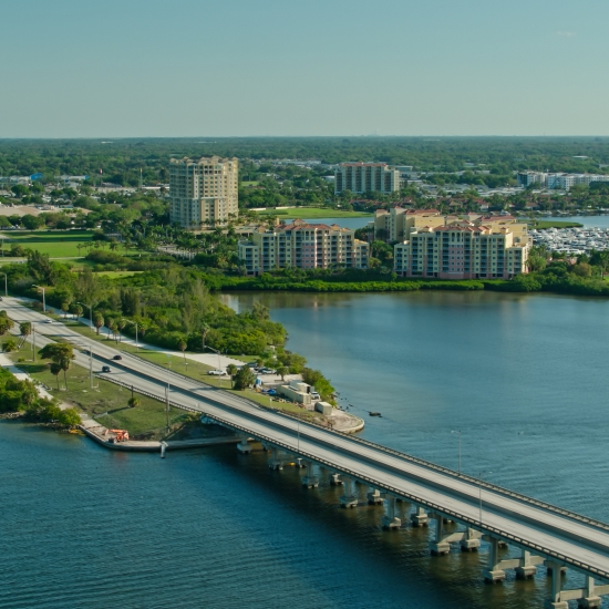 Aerial shot of the bridge leading into Palmetto, a small city in Manatee County, Florida on a sunny day.