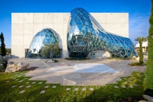Modern architecture of The Dalí Museum featuring a fluid, geodesic glass bubble built into concrete.